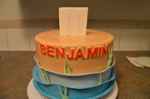 Use fondant slabs as supports behind the toppers. Toppers should only be used when completely dey.