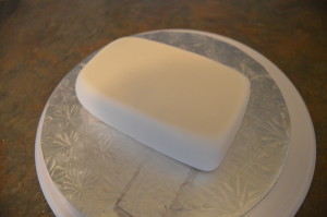 Shape fondant into a block and allow to dry for about a day so it is firm enough to carve